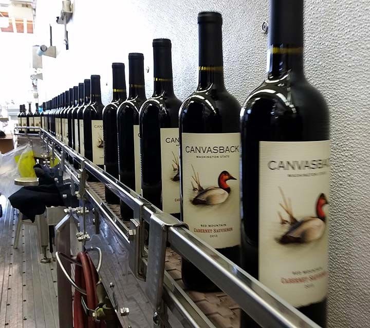 Canvasback bottles on bottling line