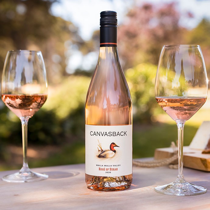 Canvasback Rose outside with two glasses